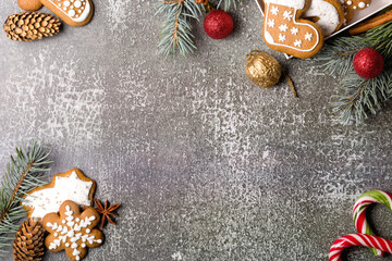 Christmas composition with gingerbread on gray background. Merry Christmas and Happy New Year. Flat lay. Copy space
