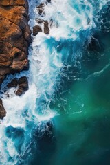 Aerial view of the ocean with rocks in the foreground, shot with drone, generated with AI