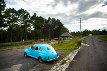 car near the highway in Cuba