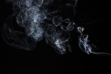 Abstract smoke on black background. Light blue texture. Design element. 