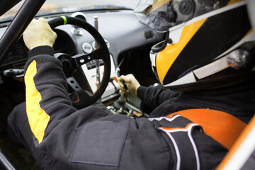 view from inside the interior of a sports car for rally or drift with a driver at the wheel