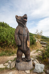 Fototapeta na wymiar Wooden bear statue in High Tatra Slovakia