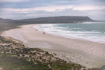 Fototapeta na wymiar Magnificent Noordhoek beach on the Cape Peninsula south of Cape Town, South Africa, is seen under cloudy skies