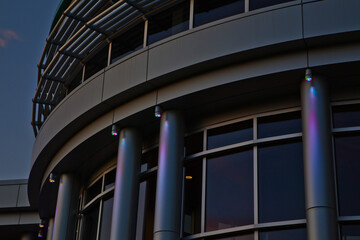 Fototapeta premium Detail of Modern Architectural Design at Dusk with Lights