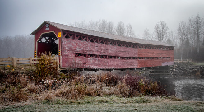 Heppell Covered Bridge on a Frosty autumn morning spanning the Matapedia River in the province of Quebec