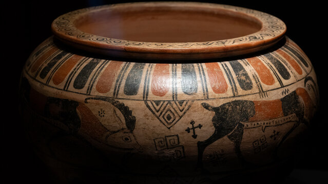 Canakkale, Turkey - Nov 19, 2023 Ancient greek earthenware pot with patterns on a black background. Exposition of ancient art at the Archaeological Museum