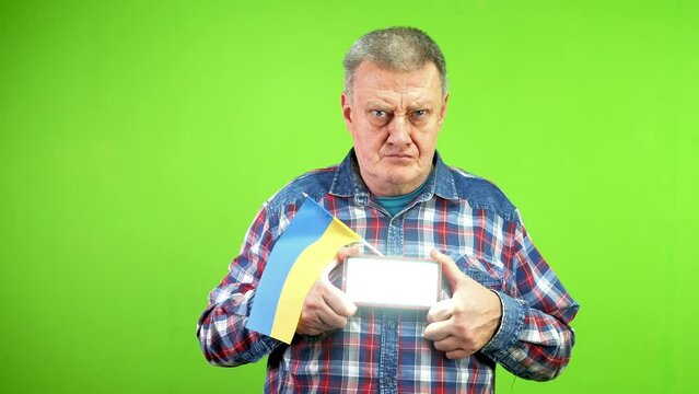 Mature man with ukrainian flag gives sos signal.