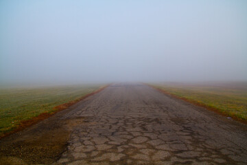 Rural Foggy Road into the Unknown, Worn and Isolated Supernatural Feel
