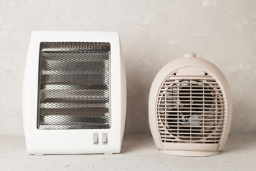 Portable electric heaters on table