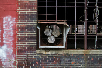 Eye-Level View of Weathered Industrial Fan in Abandoned Brick Building, Warsaw Indiana