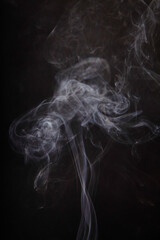 Ethereal Incense Smoke Flowing on Dark Background
