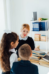 Teacher teaching children in school classroom