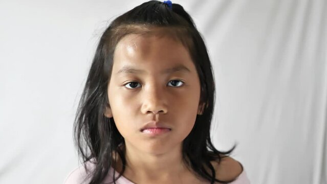 Little Asian girl with swollen bump on her forehead