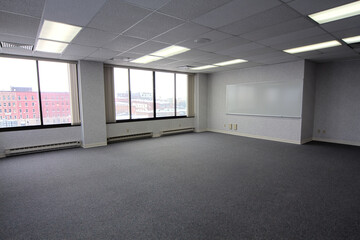 Spacious Empty Office Space with Urban View and Brainstorming Potential