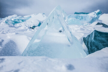 Large blocks of transparent ice on ice hummocks. Baikal lake 