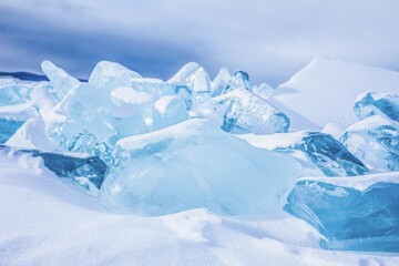 Large cracked ice floes on Baikal lake in winter day 