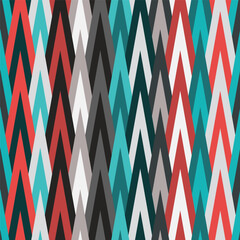 Sharp triangles pattern in blue and red shades tribal style. Vector seamless pattern design for textile, fashion, paper, packaging and branding. 