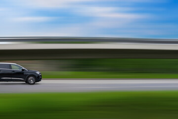 Obraz premium Car on speed blurred background. Driving car with free space for text, copy space. Car concept, car themed picture