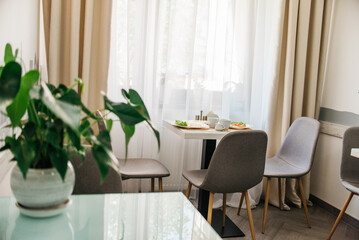 Breakfast in hotel, table by the window