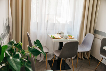 Breakfast in hotel, table by the window