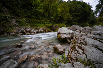 The incredible nature and beauty of pure wild river hidden deep in forest and rocks in national park Tolminska Korita in Slovenia.