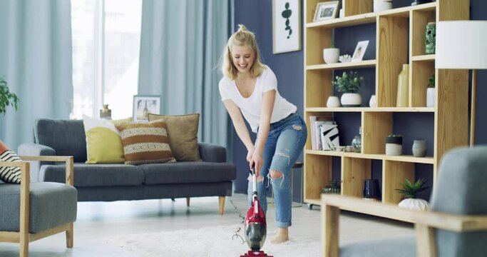 Woman, dancing and vacuum carpet with happy in living room, excited and spring cleaning in home. Young person, cheerful and housework in lounge for carefree, relax wellness and weekend in apartment