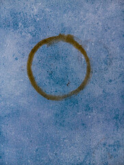 Abstract brown coffee circle background. Brown coffee circle on blue wood table with copy space.