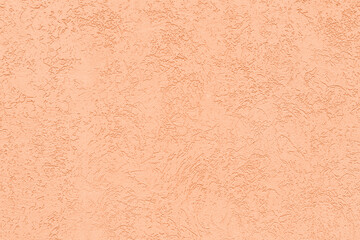 Peach background with rough texture for your design. Showcasing the color of 2024.