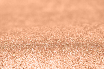 Abstract golden shiny blurred festive texture. Showcasing the color of 2024.