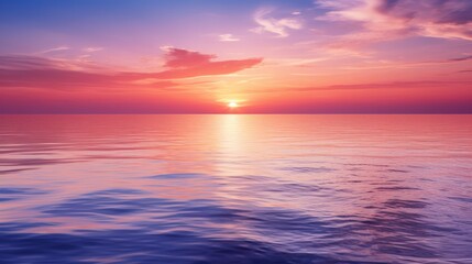 Naklejka na ściany i meble Background image captures the serene beauty of a sunset over a calm horizon, offering a perfect blend of warm hues and soothing tones. The sky is painted in a gradient of orange, pink, and lavender