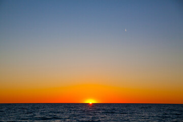 Tranquil Sunset Seascape with Crescent Moon over Lake Michigan