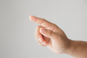 A man's hand reaches for something or points to something isolated on a white background.  touch on . virtual screen.