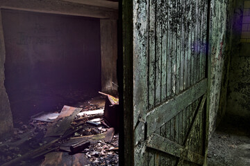 Decaying Barnwood Door Leading to Darkness of Abandoned Lima TB Hospital