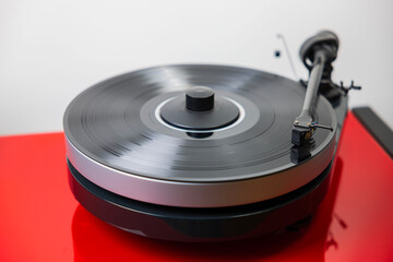 Сlose-up view of playing vinyl record on Hi-Fi turntable.