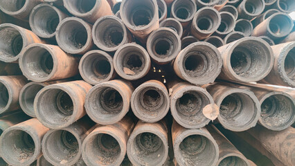 Stacked drill pipe or drill stem, used drilling rusty metal pipes