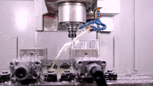 Video of a milling modern machine cutting metal in a cnc factory