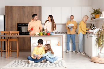 Big family spending time together in kitchen