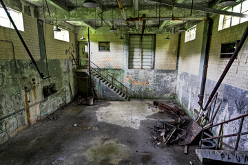 Abandoned Lima Hospital Interior with Graffiti and Decaying Staircase