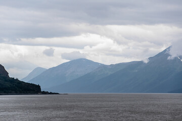 Turnagain Arm Bay Surrounded By Mountains on Cloudy Day in Alaska