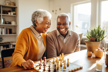Beautiful loving couple in a retirement home. Senior man and a senior lady playing table game in a nursing home. Housing facility intended for the elderly people. - obrazy, fototapety, plakaty