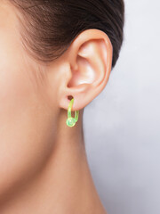 Close up image of female ear with earring