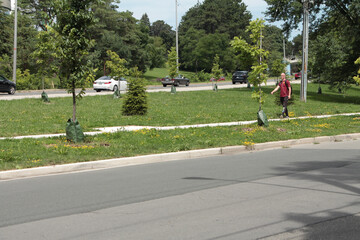 side street road in foreground with ascending descending street road in background separated by...