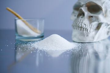 Sugar bowl with a human's skull. Sugar is the most dangerous drug in the world. 