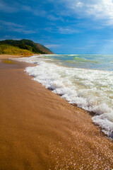 Low View of Summer Waves Meeting Sands on Lake Michigan Beach