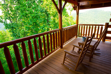 Tranquil Tennessee Porch Overlooking Lush Forest with Rocking Chairs