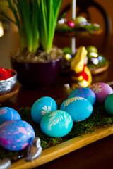 Rustic Easter Celebration with Artistic Egg Display and Spring Decorations