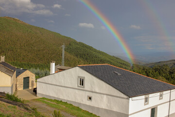 spectrum of colors above a white house