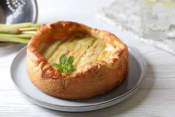 Freshly baked rhubarb pie on white wooden table