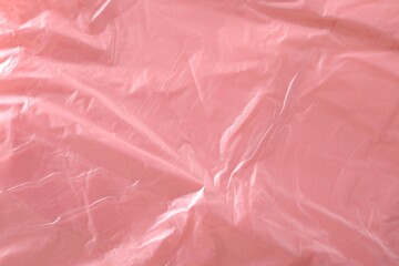 Fototapeta premium Texture of coral plastic bag as background, closeup