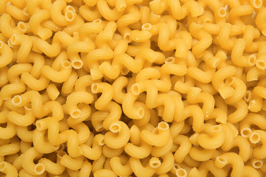 Raw cavatappi pasta as background, top view